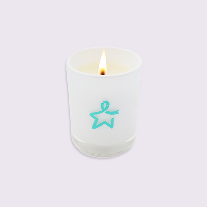 Lit white glass candle featuring a teal Star of Hope design on a white background.