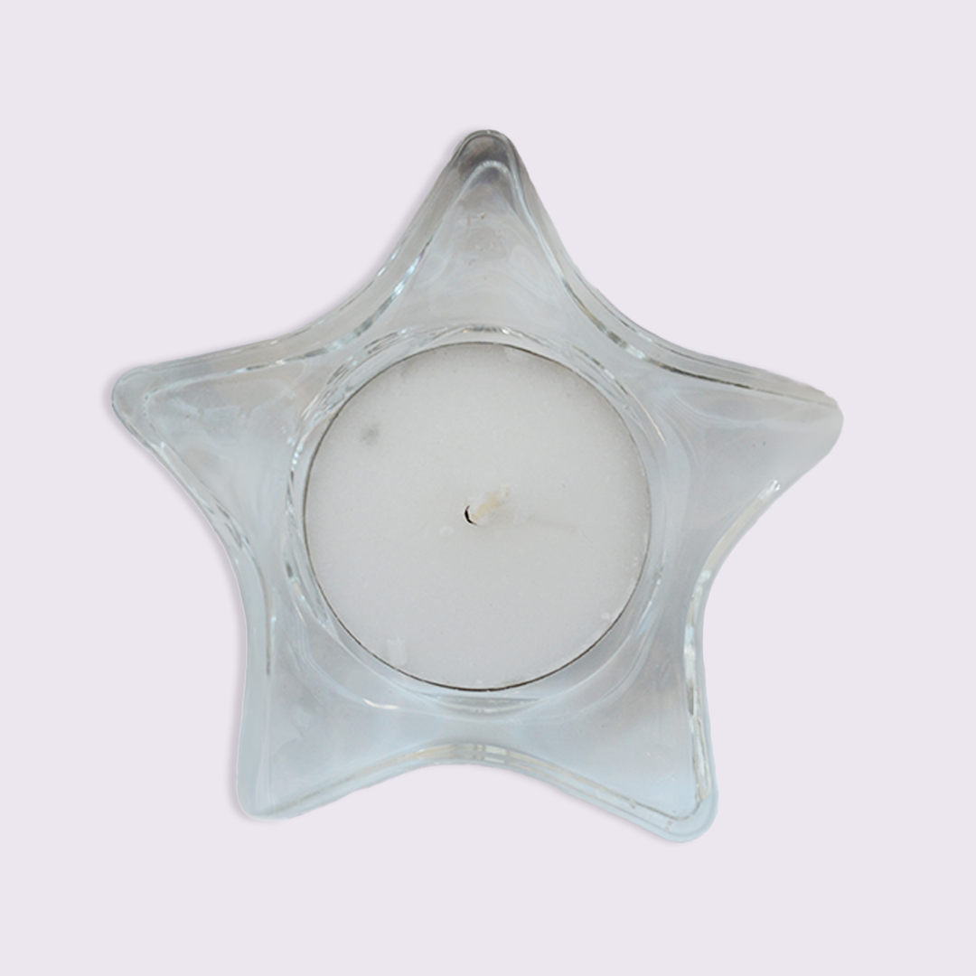 Star-shaped glass candle holder on a white background
