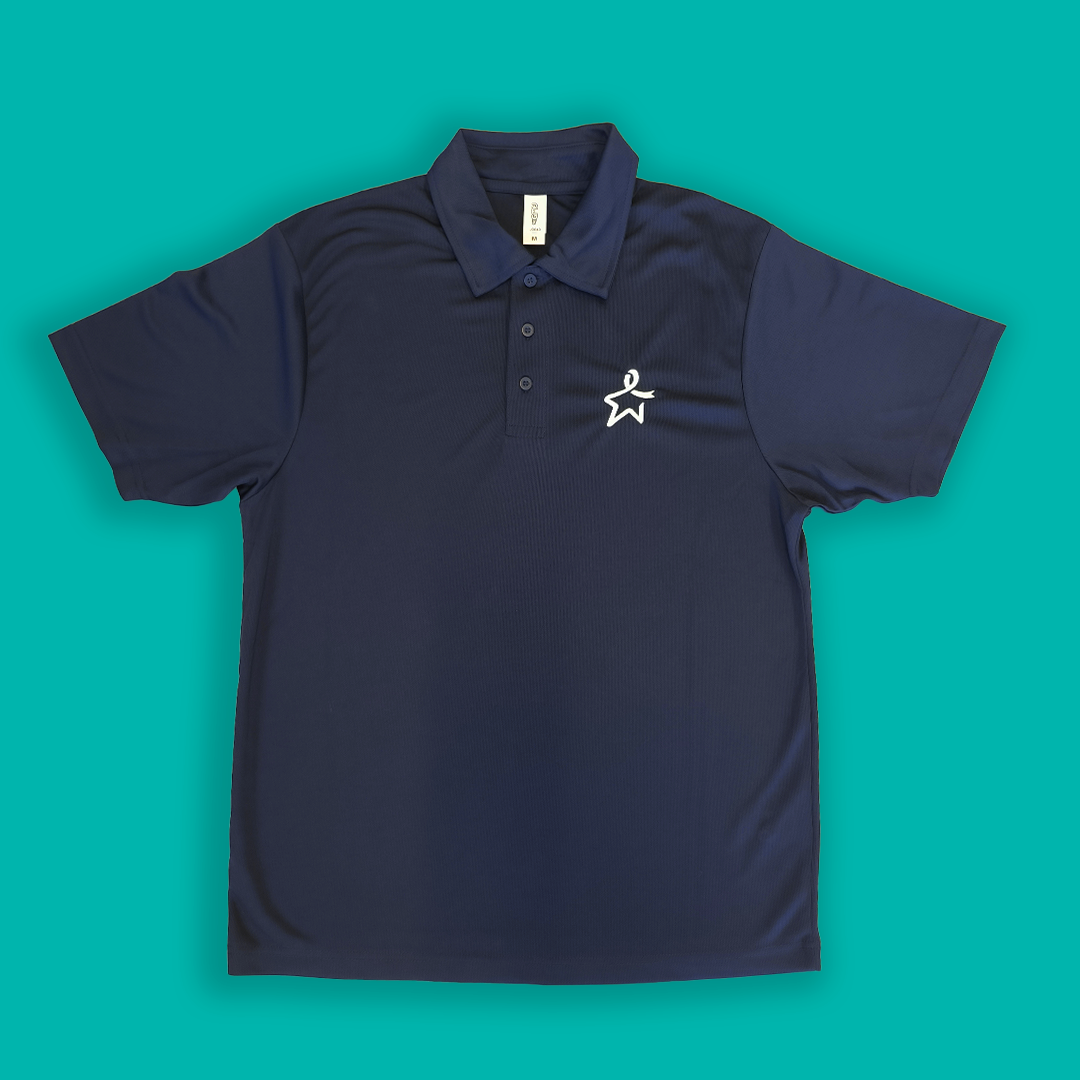 Flat lay of a French navy polo shirt featuring a white Star of Hope emblem on the left side of the chest