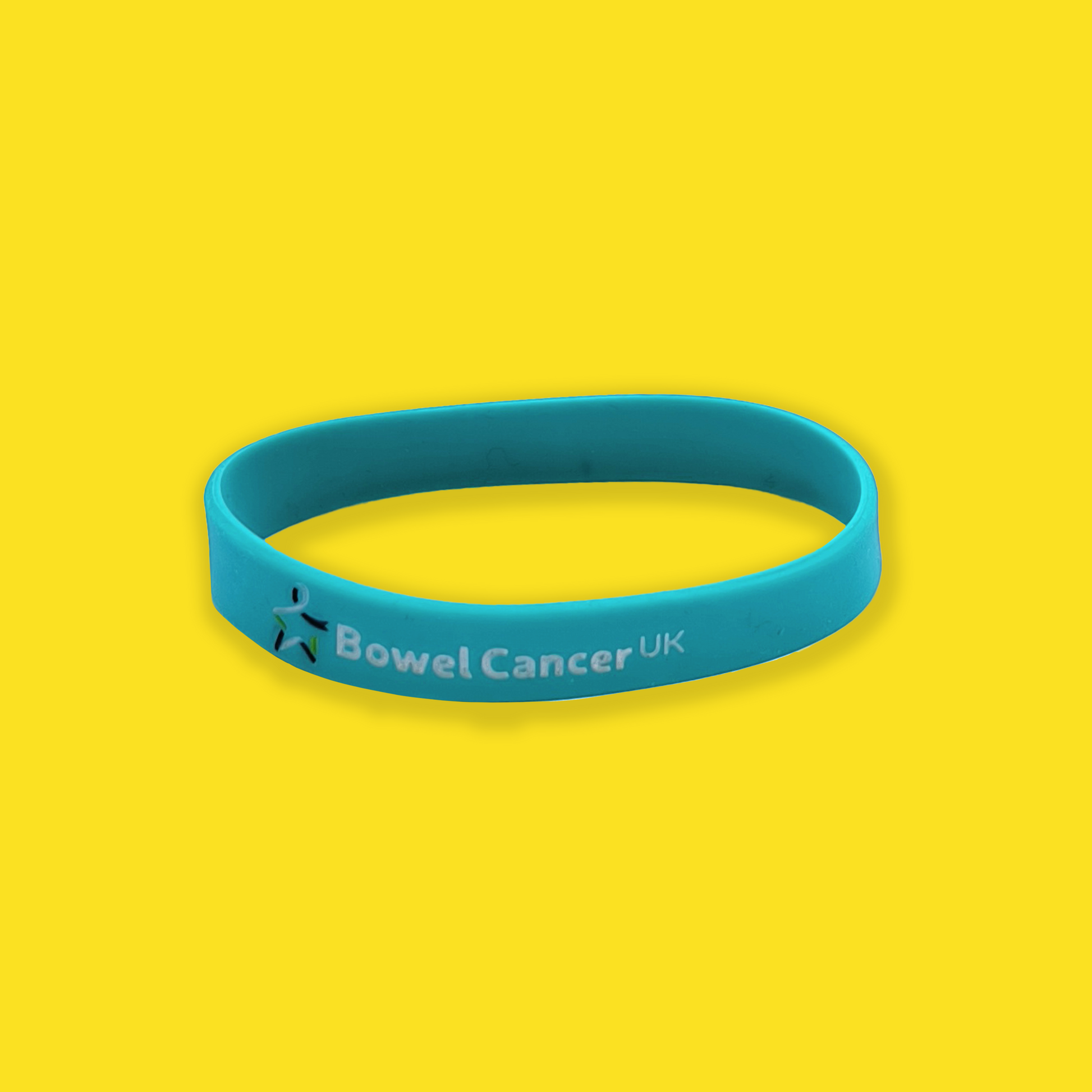 Teal wristband featuring a small multicoloured Star of Hope and “Bowel Cancer UK” printed in white text, shown against a yellow background.