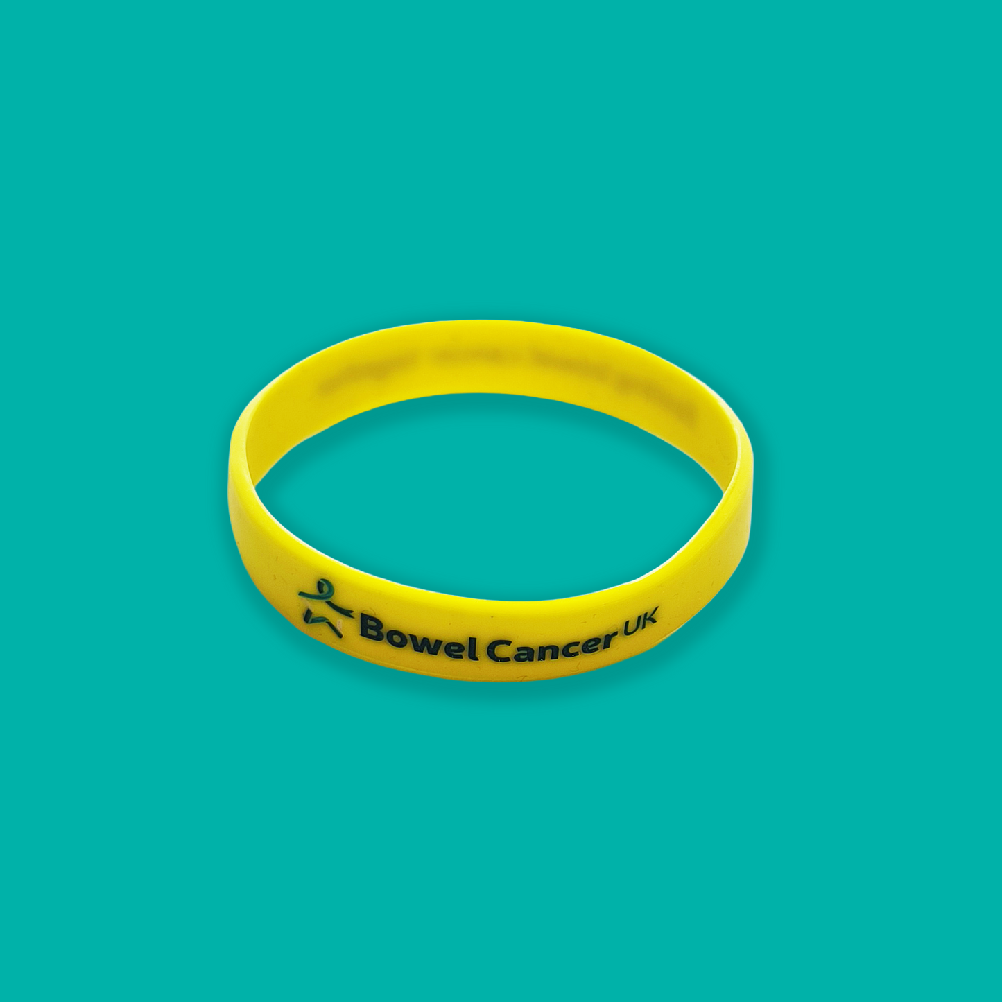 Yellow wristband featuring a small multicoloured Star of Hope and “Bowel Cancer UK” printed in dark teal text, shown against a light teal background.